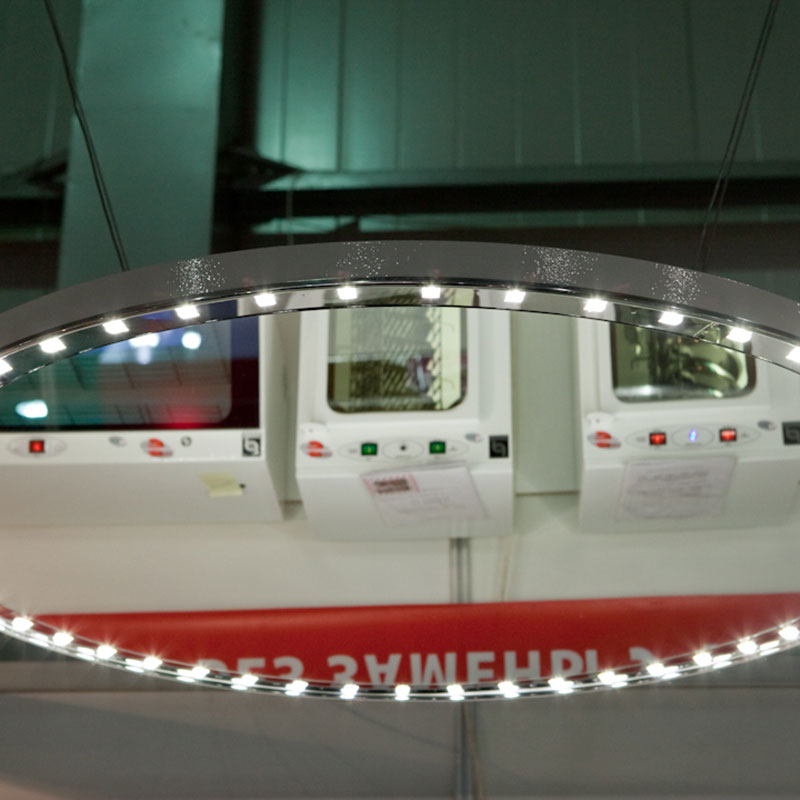 Dental surgical light with mirror